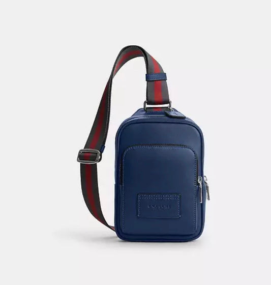 Coach Racer Sling Pack de Piel Azul Marino con Correa Web Varsity | Bolso Cruzado para Hombre